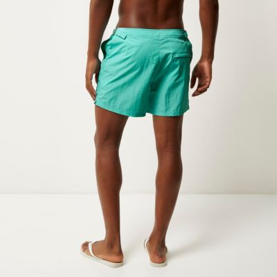 Bright green swim shorts